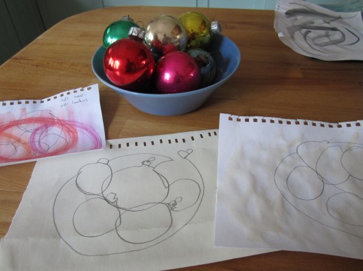 bowl of Christmas baubles and single line drawings